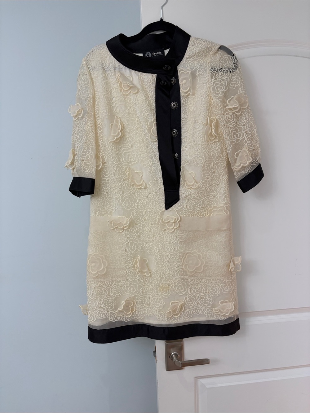 Elegant Cream Lace Shift Dress with Black Trim